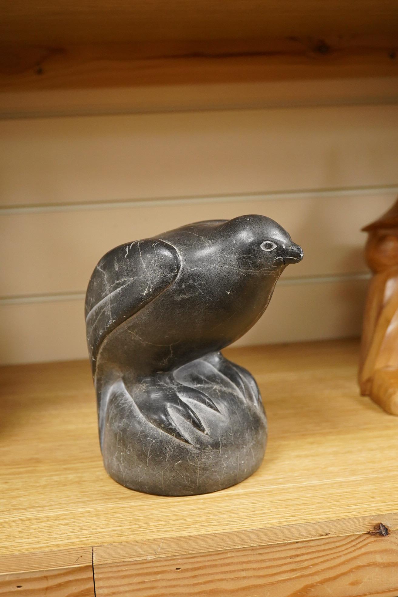 An Inuit stone carving of a falcon by Isapik, 18cm high